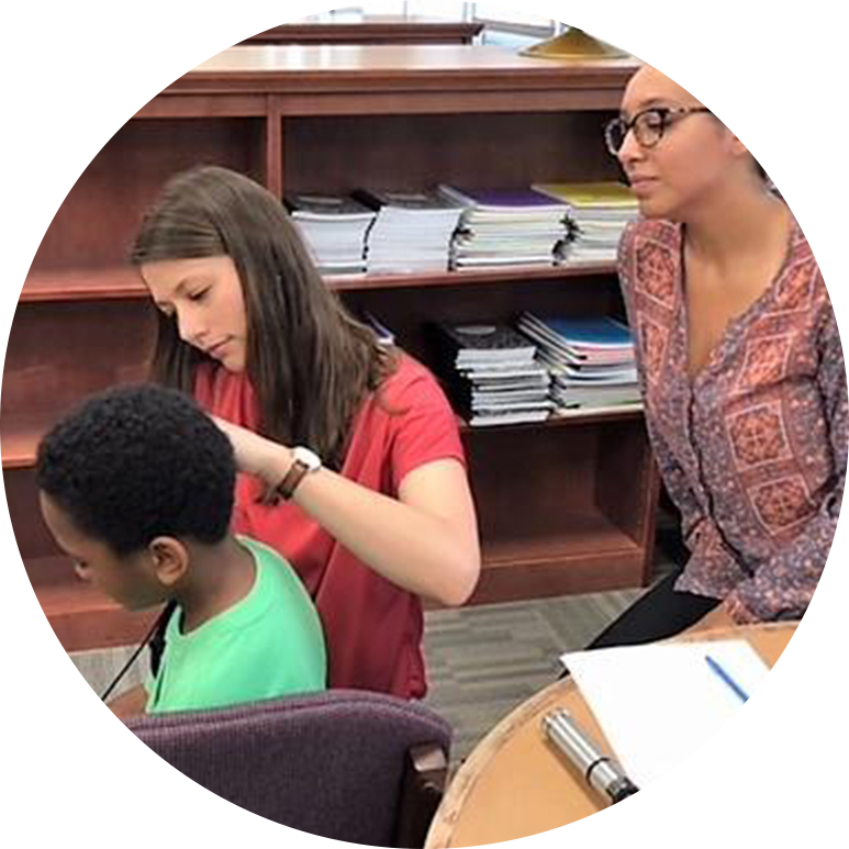 hearing therapist in a clinic with a child