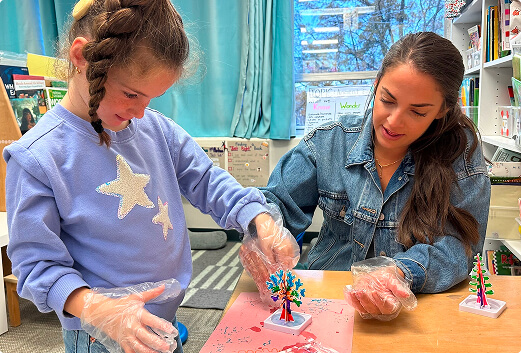 Clinical therapist woman with a child making a craft